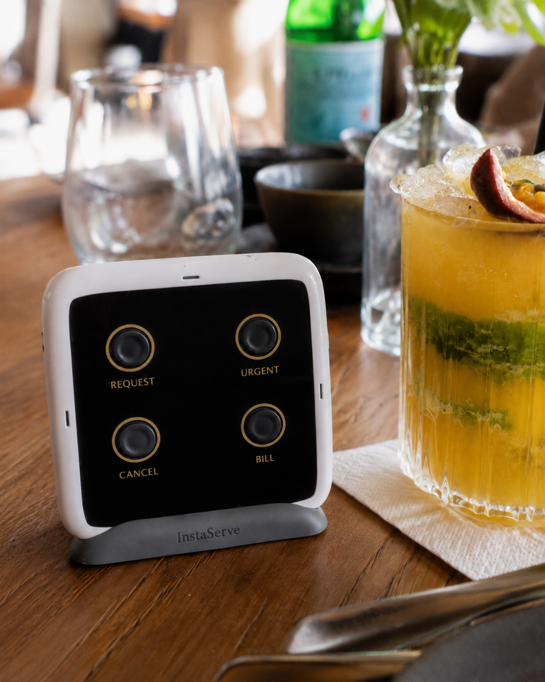 InstaServe service console on a restaurant table